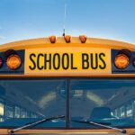 Front closeup view of a yellow school bus